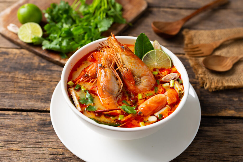 Tom yum goong, a clear hot and sour Thai soup with shrimp, lemongrass, lime and chili